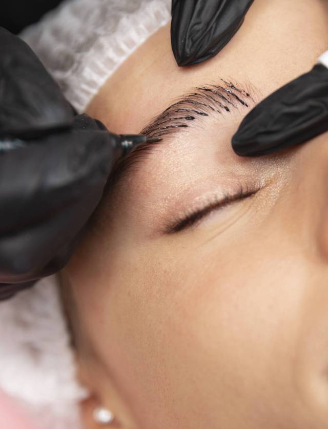 beautiful-young-woman-going-through-microblading-treatment